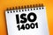 ISO 14001 international standard text on notepad, concept background