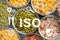 ISO 22000 - Food management. Open tin cans of conserved products, top view