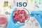 ISO 22000 - Food management. Scientist holding Petri dish with forcemeat over table, top view