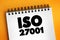 ISO 27001 - international standard on how to manage information security, text concept on notepad