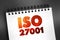 ISO 27001 - international standard on how to manage information security, text concept on notepad