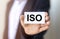 ISO acronym in male hands. Concept of standards and quality