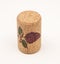 An isolatd cork with little painting of grape on it