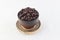 Isolate coffee beans in dark brown cup with small dish on white