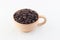 Isolate coffee beans in wood cup white background,top view