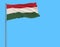 Isolate flag of Hungary on a flagpole fluttering in the wind on