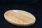 Isolate mini oval wood tray on black background, with work path.