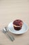 Isolate Red velvet muffin on wooden table,with spoon and fork.