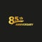 Isolated abstract golden 85th anniversary logo on black background. 85 number logotype. Eighty-five years jubilee