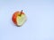 Isolated apple that has been bitten with a white background