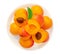 Isolated Apricot fruits on a plate. Apricot on white background. Sweet apricots with leafs closeup