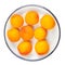 Isolated Apricot fruits on a plate. Apricot on white background. Sweet apricots with leafs closeup