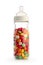 Isolated baby bottle containing colorful candies