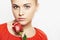 Isolated beautiful woman with flowers. girl and flower. beautiful blond girl in red dress. close-up portrait. Red rose