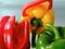 Isolated bell peppers in closeup view. red, yellow and green.