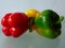 Isolated bell peppers in closeup view. red, yellow and green.