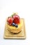 Isolated berries cheesecake on wood cutting board, berries sweet