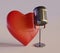 Isolated bidirectional microphone with red heart shape