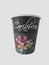 Isolated black takeaway disposable cup painted with Caribbean flowers and text