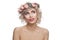 Isolated blonde woman with flowers crown on head. Pretty model with short curly haircut