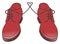 Isolated brown pair of men shoes with heart formed by shoelace
