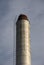 Isolated chimney against a morning sky