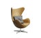Isolated classic leather armchair with striped pillow
