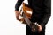 Isolated classical guitar and guitarist`s hands up close on a white background