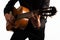 Isolated classical guitar and guitarist`s hands up close on a white background