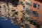 Isolated close-up of ripples on the surface of the river. reflection of building on ripples in river