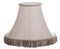 Isolated close up shot of a classic cut corner bell shaped beige tapered lamp shade with a brown fringe on a white background