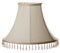 Isolated close up shot of a classic cut corner bell shaped beige tapered lampshade with a beaded fringe on a white background