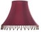 Isolated close up shot of a classic cut corner bell shaped burgundy deep red lampshade with a beaded fringe on a white background