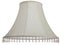 Isolated close up shot of a classic cut corner bell shaped white tapered lampshade with a beaded fringe on a white  background