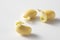 Isolated closeup of three sprouted soybeans on white background