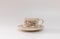 Isolated coffee cup in cream tones, old vintage style, in white background