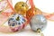 Isolated colorful Christmas baubles and ribbon