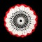 Isolated crocheted decorative white doily with red border on a black background. Round volumetric doily