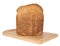 Isolated Crusty Loaf of Wholegrain Bread on Breadboard.