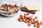 Isolated crystal bowl with hazelnuts against white background