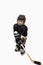 Isolated cute little kid hockey player in full hockey equipment. Helmet, gloves, stick.