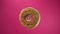 Isolated donut rotates on pink background. A beautiful footage of sweets for children and adults. Gourmet breakfast. Not