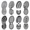 Isolated footprint vector silhouettes. Dirty shoes and sneakers footprints