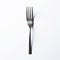 Isolated Fork On White Surface: A Primitivist Exploration Of Depth Perception