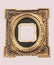 Isolated golden tintype picture frame. Old tintype frame in center surrounded by modern oval frame with embossed floral design.