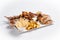 Isolated grilled meat and beer appetizers platter