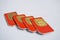 Isolated group of four red SIM cards used in the mobile phones (cell phone) with focus on golden micro chip