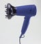 Isolated hair dryer on gray