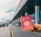 Isolated hand holding an Italian passport with out of focus airport entranceway