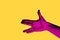 Isolated hand photo on yellow background. Pink hand collage style.